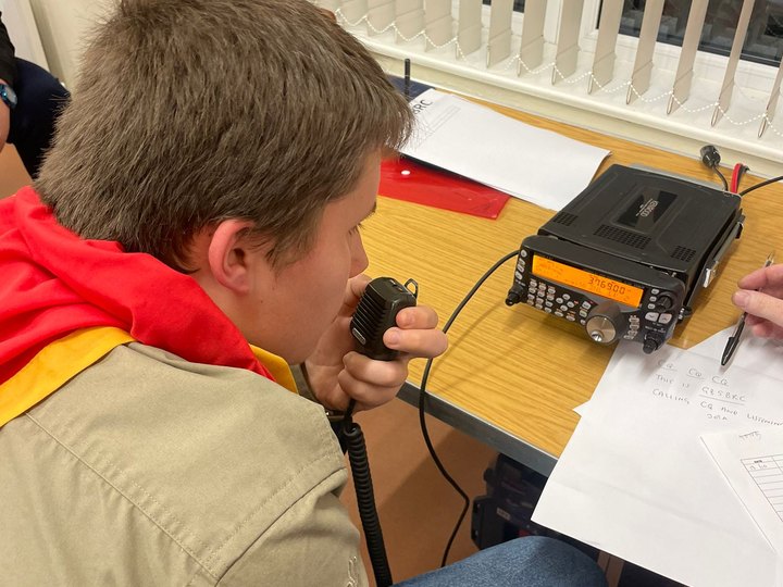 A young operator getting hands-on experience at the club radio station.